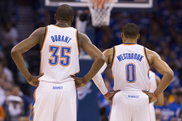 OKLAHOMA CITY, OK - May 27:  Kevin Durant #35 and Russell Westbrook #0 of the Oklahoma City Thunder look on against the San Antonio Spurs in Game 4 of the Western Conference Finals during the 2014 NBA Playoffs at the Chesapeake Arena on May 27, 2014 in Oklahoma City, Oklahoma. NOTE TO USER:  User expressly acknowledges and agrees that, by downloading and/or using this photograph, user is consenting to the terms and conditions of the Getty Images License Agreement. Mandatory Copyright Notice:  Copyright 2014 NBAE (Photo by Richard Rowe/NBAE via Getty Images)