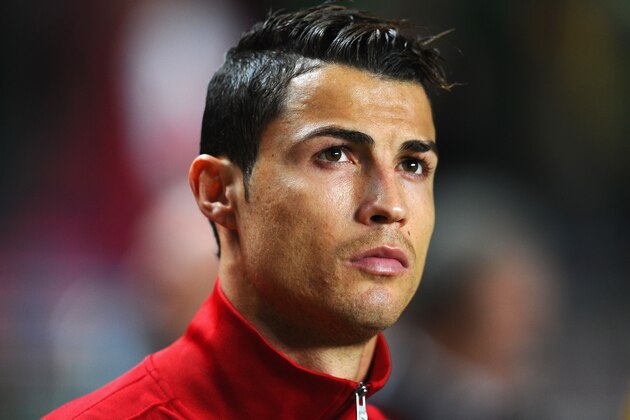 LISBON, PORTUGAL - NOVEMBER 15:  Cristiano Ronaldo of Portugal looks focussed during the National Anthems ahead of the FIFA 2014 World Cup Qualifier Play-off First Leg between Portugal and Sweden at Estadio da Luz on November 15, 2013 in Lisbon, Portugal.  (Photo by Mike Hewitt/Getty Images)