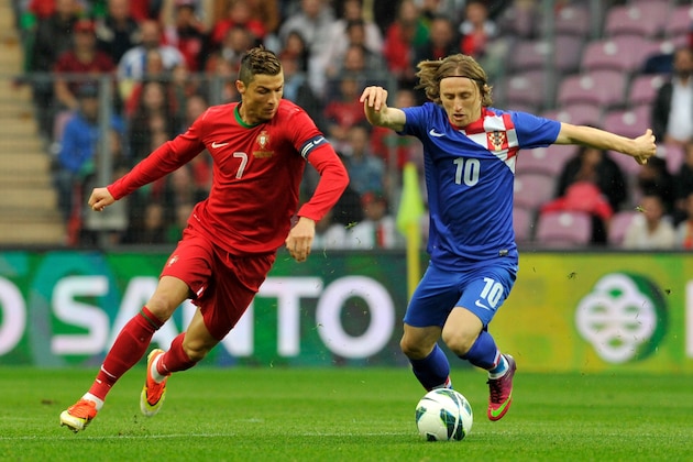 GENEVA, SWITZERLAND - JUNE 10:  Cristiano Ronaldo of Portugal competes for the ball with Luka Modric (R) of Croatia during the international friendly match between Portugal and Croatia on June 10, 2013 in Geneva, Switzerland.  (Photo by Harold Cunningham/Getty Images)