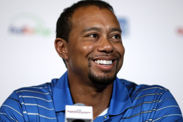 Golfer Tiger Woods speaks at a Quicken Loans National PGA tournament media day news conference at Congressional Country Club, Monday, May 19, 2014, in Bethesda, Md. Woods said his back injury was so debilitating that it caused him to doubt whether he would play golf again. While the surgery he had March 31 erased those doubts, he still has no timetable for his return. (AP Photo/Patrick Semansky)