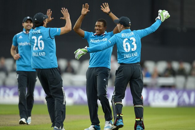 MANCHESTER, ENGLAND - MAY 28:  Chris Jordan of England celebrates with England captain Alastair Cook and Jos Buttler after dismissing Nuwan Kulasekara of Sri Lanka during the 3rd Royal London One Day International match between England and Sri Lanka at Old Trafford on May 28, 2014 in Manchester, England.  (Photo by Gareth Copley/Getty Images)