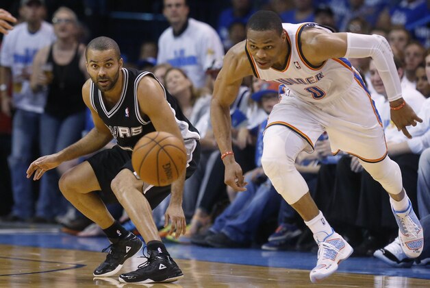 San Antonio Spurs guard Tony Parker, left, and Oklahoma City Thunder guard Russell Westbrook (0) watch a loose ball in the second quarter of Game 4 of the Western Conference finals NBA basketball playoff series in Oklahoma City, Tuesday, May 27, 2014. (AP Photo/Sue Ogrocki)