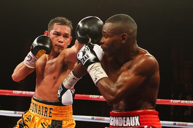 NEW YORK, NY - APRIL 13:  Nonito Donaire punches Guillermo Rigondeaux during their WBO/WBA junior featherweight title unification bout at Radio City Music Hall on April 13, 2013 in New York City.  (Photo by Al Bello/Getty Images)