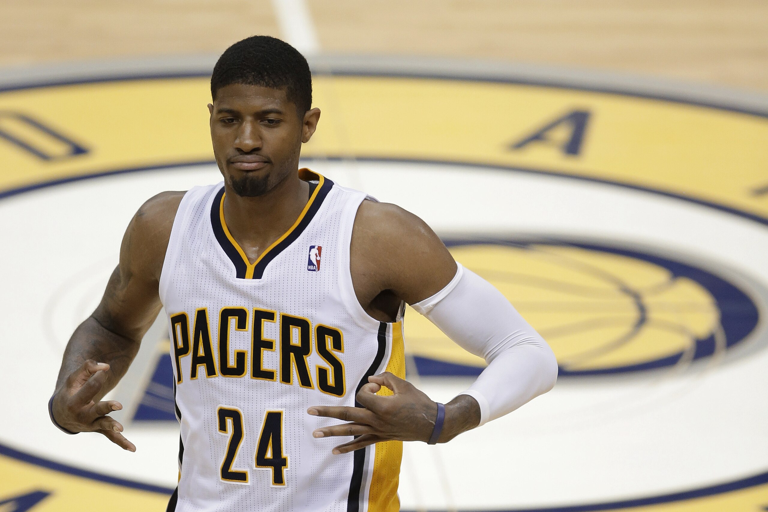 Indiana Pacers' Paul George gestures after hitting a 3-point shot during the second half of Game 5 of the Eastern Conference finals NBA basketball playoff series against the Miami Heat on Wednesday, May 28, 2014, in Indianapolis. (AP Photo/Darron Cummings)