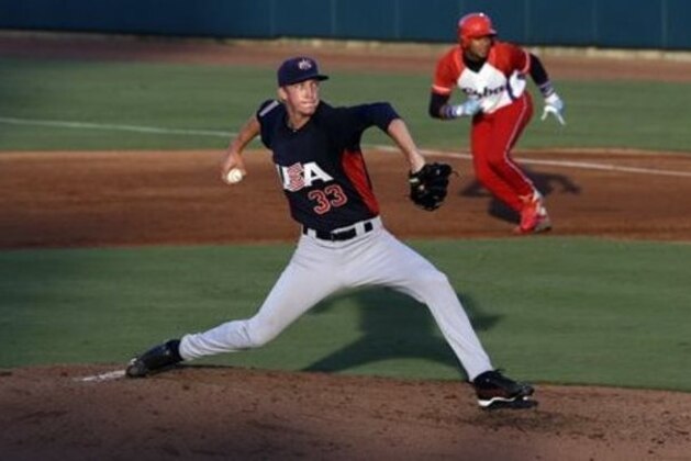 United States pitcher Erick Fedde (33) winds up during the second inning of an exhibition baseball game against Cuba in Cary, N.C., Monday, July 22, 2013. (AP Photo/Gerry Broome)
