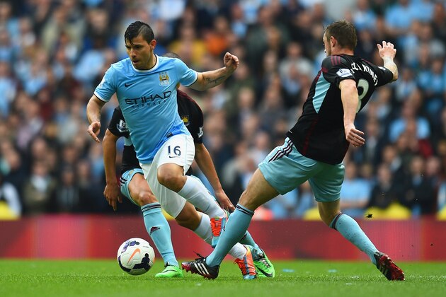 MANCHESTER, ENGLAND - MAY 11: Sergio Aguero of Manchester City is challenged by George McCartney of West Ham United during the Barclays Premier League match between Manchester City and West Ham United at the Etihad Stadium on May 11, 2014 in Manchester, England. (Photo by Shaun Botterill/Getty Images) MANCHESTER, ENGLAND - MAY 11: Sergio Aguero of Manchester City is challenged by George McCartney of West Ham United during the Barclays Premier League match between Manchester City and West Ham United at the Etihad Stadium on May 11, 2014 in Manchester, England. (Photo by Shaun Botterill/Getty Images)