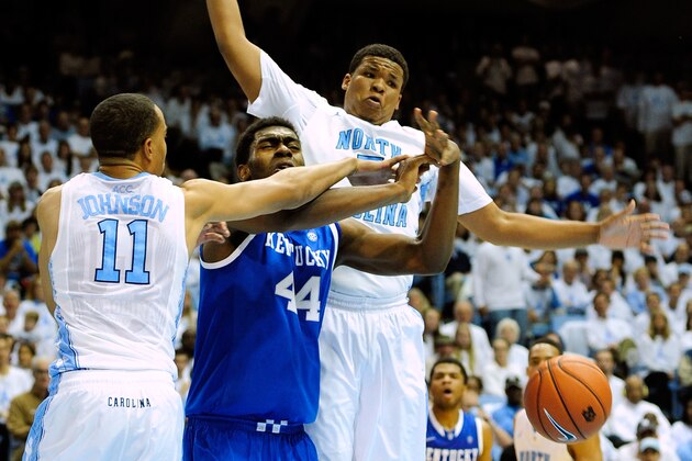 CHAPEL HILL, NC - DECEMBER 14:  Brice Johnson #11 and Kennedy Meeks #3 of the North Carolina Tar Heels force a turnover by Dakari Johnson #44 of the Kentucky Wildcats during play at the Dean Smith Center on December 14, 2013 in Chapel Hill, North Carolina.  (Photo by Grant Halverson/Getty Images)