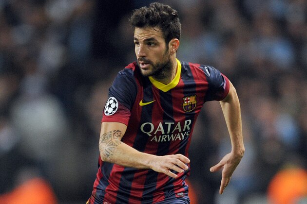 Barcelona's Cesc Fabregas during their Champions League Round of 16 soccer match against Manchester City at the Etihad Stadium in Manchester, England, Tuesday, Feb. 18, 2014. (AP Photo/Clint Hughes)