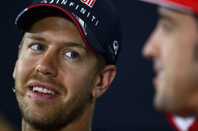 MONTMELO, SPAIN - MAY 08:  Sebastian Vettel (L) of Germany and Infiniti Red Bull Racing looks on next to Fernando Alonso of Spain and Ferrar during a press conference ahead of the Spanish F1 Grand Prix at Circuit de Catalunya on May 8, 2014 in Montmelo, Spain.  (Photo by Clive Mason/Getty Images)