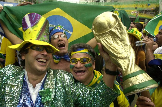 Brazilian soccer fans celebrate the Brazil team's victory at a World Cup street party in Rio de Janeiro, Brazil, Wednesday, June 27, 2002. Brazil defeated Turkey in a semifinal of the World Cup in Japan to advance to the final, where they will face Germany.(AP Photo/Douglas Engle)
