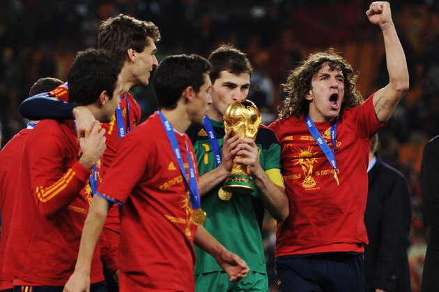 JOHANNESBURG, SOUTH AFRICA - JULY 11:  Iker Casillas of Spain kisses the World Cup trophy as the Spain team celebrate victory following the 2010 FIFA World Cup South Africa Final match between Netherlands and Spain at Soccer City Stadium on July 11, 2010 in Johannesburg, South Africa.  (Photo by Jasper Juinen/Getty Images)