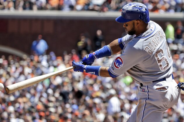 Chicago Cubs' Emilio Bonifacio drives in a run with a triple against the San Francisco Giants during the fifth inning of a baseball game on Monday, May 26, 2014, in San Francisco. (AP Photo/Marcio Jose Sanchez)