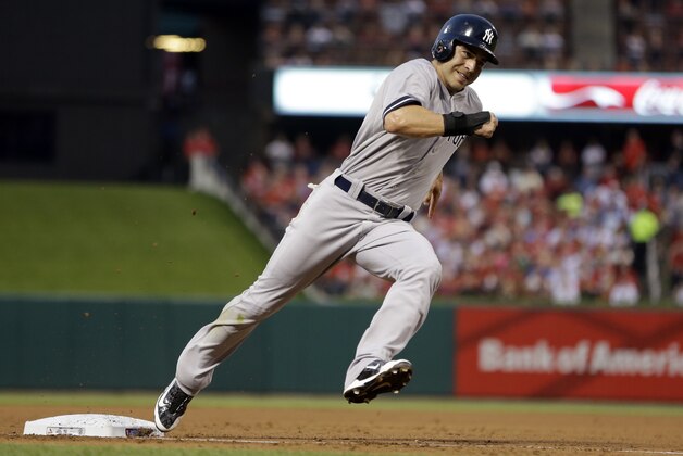 New York Yankees' Jacoby Ellsbury rounds third and heads for home on a two-run single by John Ryan Murphy during the third inning of a baseball game against the St. Louis Cardinals Wednesday, May 28, 2014, in St. Louis. (AP Photo/Jeff Roberson)