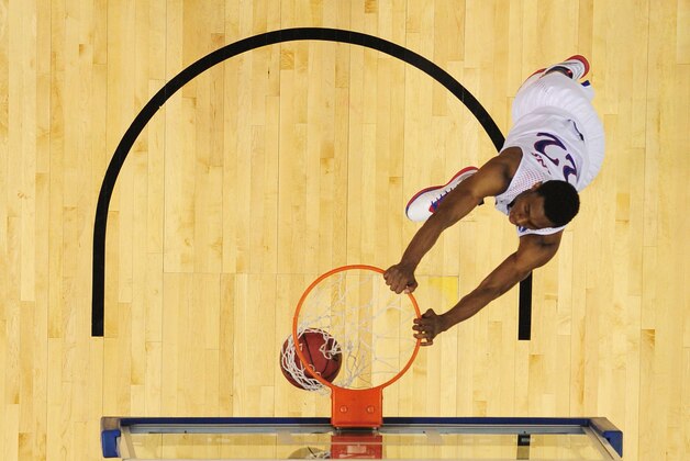 Mar 21, 2014; St. Louis, MO, USA; Kansas Jayhawks guard Andrew Wiggins (22) dunks the ball against the Eastern Kentucky Colonels in the first half during the 2nd round of the 2014 NCAA Men's  Basketball Championship at Scottrade Center. Mandatory Credit: Scott Rovak-USA TODAY Sports