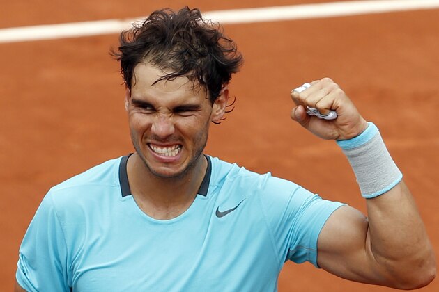Spain's Rafael Nadal clenches his fist after defeating Austria's Dominic Thiem during the second round match of  the French Open tennis tournament at the Roland Garros stadium, in Paris, France, Thursday, May 29, 2014. Nadal won 6-2, 6-2, 6-3. (AP Photo/Darko Vojinovic)