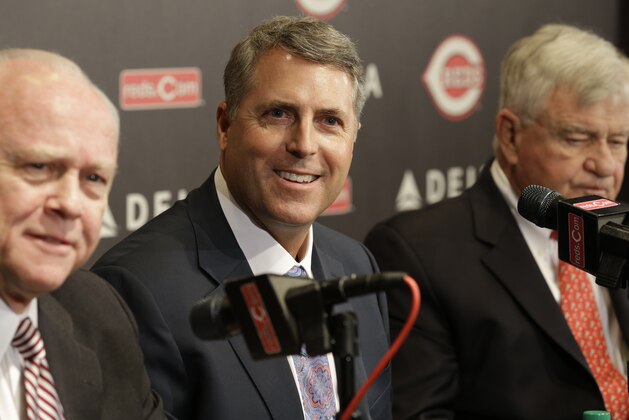 Bryan Price answers questions with general manager Walt Jocketty, left, and team owner Bob Castellini, after Price was named manager of the Cincinnati Reds baseball team, Tuesday, Oct. 22, 2013, in Cincinnati. (AP Photo/Al Behrman)