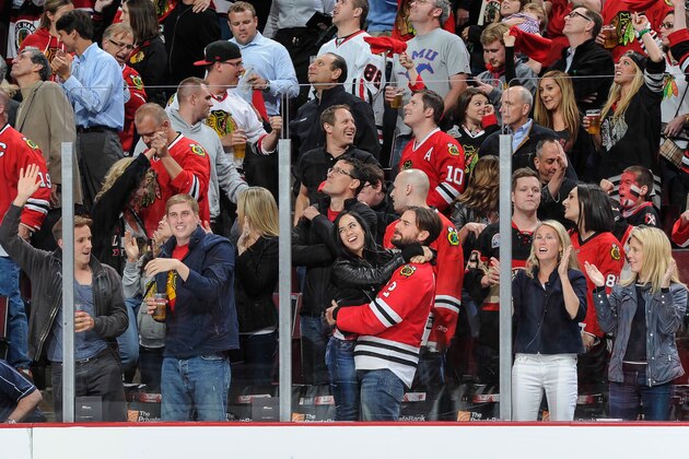 CHICAGO, IL - MAY 28: Engaged WWE wrestlers AJ Lee and CM Punk celebrate after the Chicago Blackhawks scored against the Los Angeles Kings in Game Five of the Western Conference Final during the 2014 NHL Stanley Cup Playoffs at the United Center on May 28, 2014 in Chicago, Illinois. (Photo by Bill Smith/NHLI via Getty Images)
