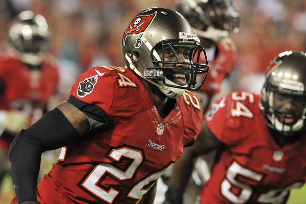 TAMPA, FL - NOVEMBER 11:  Cornerback Darrelle Revis #24 of the Tampa Bay Buccaneers celebrates after a 4th-quarter interception against the Miami Dolphins November 11, 2013 at Raymond James Stadium in Tampa, Florida. Tampa won 22 - 19. (Photo by Al Messerschmidt/Getty Images)