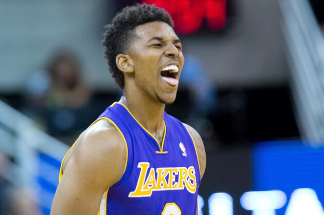 Apr 14, 2014; Salt Lake City, UT, USA; Los Angeles Lakers forward Nick Young (0) reacts during the second half against the Utah Jazz at EnergySolutions Arena. The Lakers won 119-104. Mandatory Credit: Russ Isabella-USA TODAY Sports