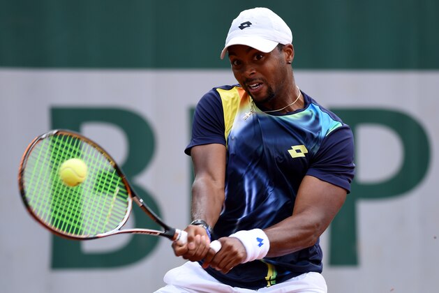 PARIS, FRANCE - MAY 26:  Donald Young of the United States returns a shot during his men's singles match against Dudi Sela of Israel on day two of the French Open at Roland Garros on May 26, 2014 in Paris, France.  (Photo by Matthias Hangst/Getty Images)