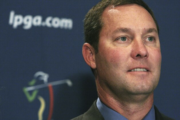FILE - In this Oct. 28, 2009, file photo, Mike Whan paues during a news conference in New York announcing his appointment as the LPGA commissioner. What decided in 2010 to elevate the Evian Masters in France to major championship status starting in 2013, giving the LPGA Tour five majors for the first time in its 63-year history. Just his luck, that turned out to be the same year one of the players, Inbee Park, has a shot at the Grand Slam. (AP Photo/Tina Fineberg, File)