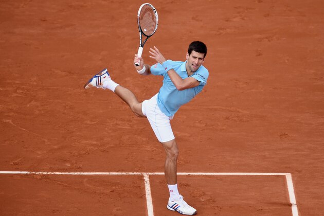PARIS, FRANCE - MAY 28:  Novak Djokovic of Serbia returns a shot during his men's singles match against Jeremy Chardy of France on day four of the French Open at Roland Garros on May 28, 2014 in Paris, France.  (Photo by Matthias Hangst/Getty Images)