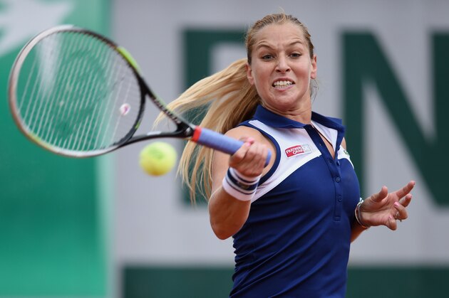 PARIS, FRANCE - MAY 28:  Dominika Cibulkova of Slovakia returns a shot during her women's singles match against Tamira Paszek of Austria on day four of the French Open at Roland Garros on May 28, 2014 in Paris, France.  (Photo by Matthias Hangst/Getty Images)
