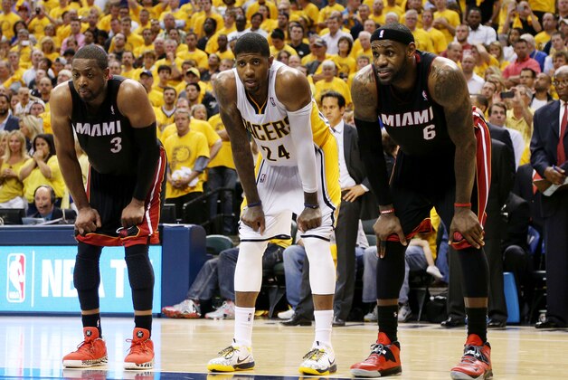 May 28, 2014; Indianapolis, IN, USA; Miami Heat guard Dwyane Wade (3), Indiana Pacers forward Paul George (24), and Miami Heat forward LeBron James (6) rest during a pause in action during the fourth quarter in game five of the Eastern Conference Finals of the 2014 NBA Playoffs at Bankers Life Fieldhouse.  Indiana defeats Miami 93-90. Mandatory Credit: Brian Spurlock-USA TODAY Sports
