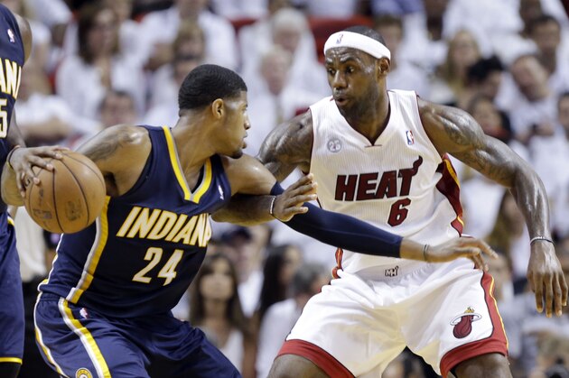 Miami Heat forward LeBron James (6) defends Indiana Pacers forward Paul George (24) during the second half of Game 5 in the NBA basketball playoffs Eastern Conference finals, Thursday, May 30, 2013, in Miami. (AP Photo/Lynne Sladky)