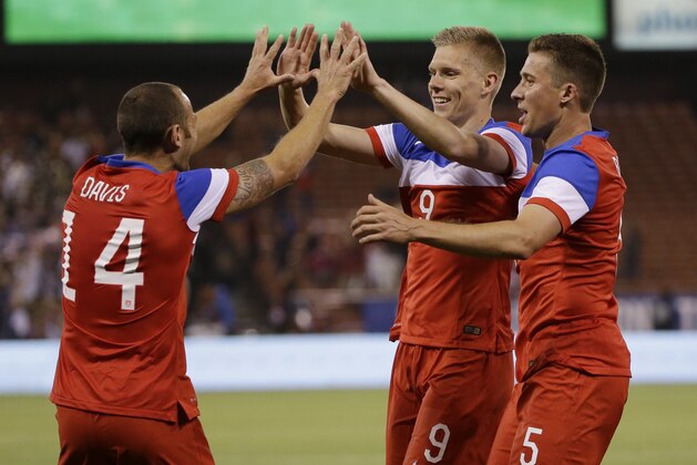 United States' Aron Johannsson (9) celebrates his goal with teammate Matt Besler, right, and Brad Davis (14)  during the second half of an international friendly soccer match against Azerbaijan on Tuesday, May 27, 2014, in San Francisco. United States won 2-0. (AP Photo/Marcio Jose Sanchez)