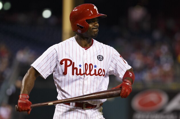 Philadelphia Phillies' Jimmy Rollins reacts to striking out during the fourth inning of a baseball game against the Cincinnati Reds, Saturday, May 17, 2014, in Philadelphia. The Phillies won 12-1. (AP Photo/Chris Szagola)
