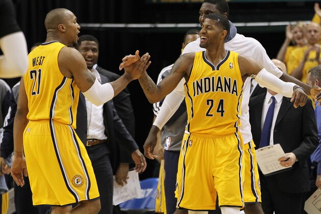 May 3, 2014; Indianapolis, IN, USA; Indiana Pacers forward Paul George (24) and forward David West (21) celebrate during the fourth quarter against the Atlanta Hawks in game seven of the first round of the 2014 NBA Playoffs at Bankers Life Fieldhouse. Indiana won 92-80. Mandatory Credit: Pat Lovell-USA TODAY Sports