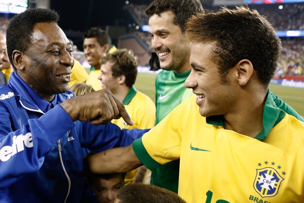 Sep 10, 2013; Foxborough, MA, USA; Brazil soccer legend Pele, left, greets Brazil forward Neymar before the friendly between Brazil and Portugal at Gillette Stadium. Mandatory Credit: Winslow Townson-USA TODAY Sports