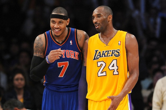 LOS ANGELES, CA - DECEMBER 29:  Carmelo Anthony #7 of the New York Knicks and Kobe Bryant #24 of the Los Angeles Lakers look on during their game at Staples Center on December 29, 2011 in Los Angeles, California. NOTE TO USER: User expressly acknowledges and agrees that, by downloading and/or using this Photograph, user is consenting to the terms and conditions of the Getty Images License Agreement. Mandatory Copyright Notice: Copyright 2011 NBAE (Photo by Juan Ocampo/NBAE via Getty Images)