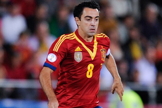 PALMA DE MALLORCA, SPAIN - OCTOBER 11:  Xavi Hernandez of Spain runs with the ball during the FIFA 2014 World Cup Qualifier match between Spain and Belarus at Iberostars Stadium on October 11, 2013 in Palma de Mallorca, Spain.  (Photo by David Ramos/Getty Images)
