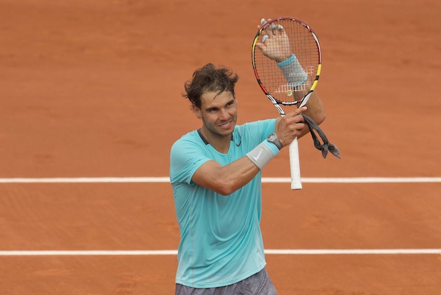 May 29, 2014; Paris, Paris, France; Rafael Nadal (ESP) celebrates recording match point during his match against Dominic Thiem (AUT) on day five at the 2014 French Open at Roland Garros. Mandatory Credit: Susan Mullane-USA TODAY Sports