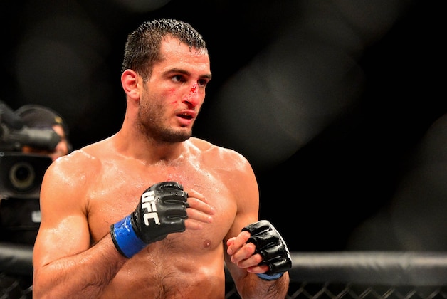 Feb 15, 2014; Jaragua do Sul, SC, Brazil; Lyoto Machida (red gloves) fights against Gegard Mousasi (blue gloves) during UFC Fight Night Machida vs Mousasi at Arena Jaragua. Mandatory Credit: Jason Silva-USA TODAY Sports