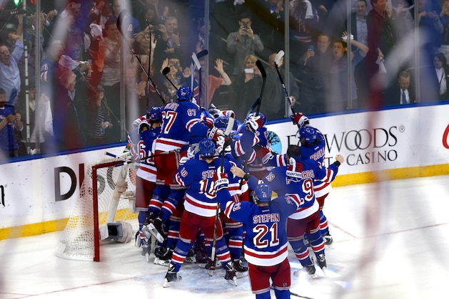 NEW YORK, NY - MAY 29:  The New York Rangers celebrates after defeating the Montreal Canadiens in Game Six to win the Eastern Conference Final in the 2014 NHL Stanley Cup Playoffs at Madison Square Garden on May 29, 2014 in New York City. The New York Rangers defeated the Montreal Canadiens 1 to 0.  (Photo by Elsa/Getty Images)