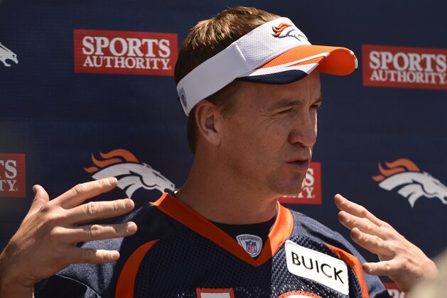 Denver Broncos' Peyton Manning talks to the media following  an NFL football organized team activity, Wednesday, May 28, 2014, in Englewood, Colo. (AP Photo/Jack Dempsey)