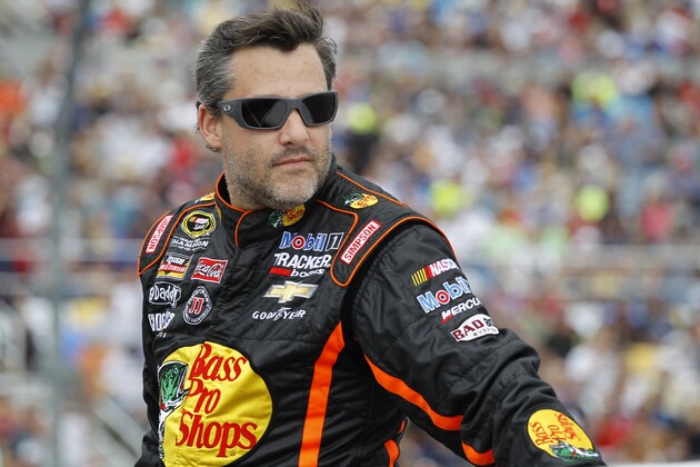 Tony Stewart is introduced before the NASCAR Daytona 500 Sprint Cup series auto race at Daytona International Speedway in Daytona Beach, Fla., Sunday, Feb. 23, 2014. (AP Photo/Terry Renna)