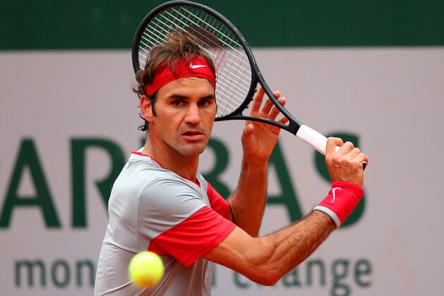 PARIS, FRANCE - MAY 28:  Roger Federer of Switzerland returns a shot during his men';s singles match against Diego Sebastian Schwartzman of Argentina on day four of the French Open at Roland Garros on May 28, 2014 in Paris, France.  (Photo by Clive Brunskill/Getty Images)