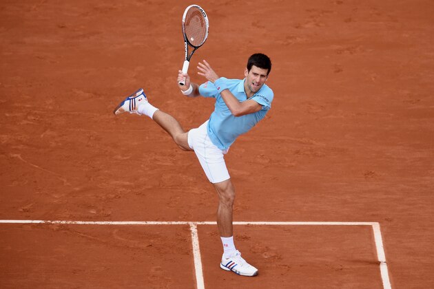 PARIS, FRANCE - MAY 28:  Novak Djokovic of Serbia returns a shot during his men's singles match against Jeremy Chardy of France on day four of the French Open at Roland Garros on May 28, 2014 in Paris, France.  (Photo by Matthias Hangst/Getty Images)