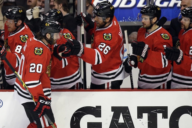 Chicago Blackhawks' Brandon Saad (20) celebrates with teammates after scoring his goal against the Los Angeles Kings during the first period in Game 5 of the Western Conference finals in the NHL hockey Stanley Cup playoffs on Wednesday, May 28, 2014, in Chicago. (AP Photo/Nam Y. Huh)