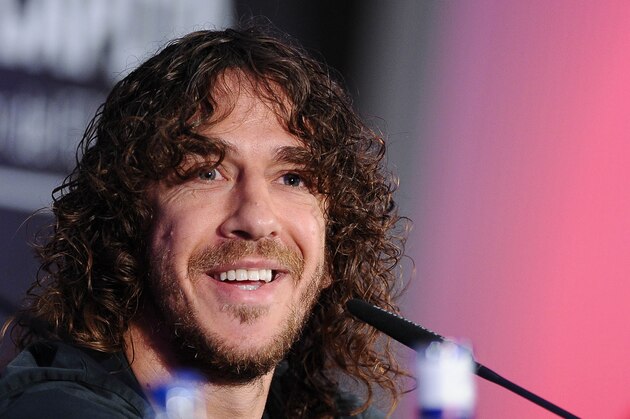 FC Barcelona's Carles Puyol smiles, during a press conference at the Nou Camp stadium in Barcelona, Spain, Thursday, May 15, 2014. Puyol reluctantly quit football on Thursday,  his knees no longer able to endure the demands of the Barcelona defense after 15 years, the most successful period in the club's history. (AP Photo)