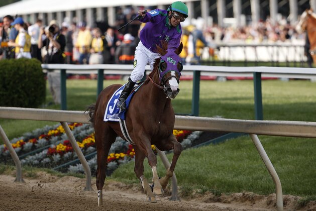 May 17, 2014; Baltimore, MD, USA; Victor Espinoza aboard California Chrome celebrates winning the 139th Preakness Stakesat Pimlico Race Course. Mandatory Credit: Winslow Townson-USA TODAY Sports