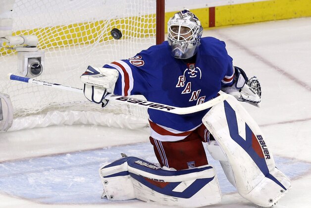 New York Rangers goalie Henrik Lundqvist makes a save during the first period of Game 4 of the NHL hockey Stanley Cup playoffs Eastern Conference finals against the Montreal Canadiens, Sunday, May 25, 2014, in New York. (AP Photo/Seth Wenig)