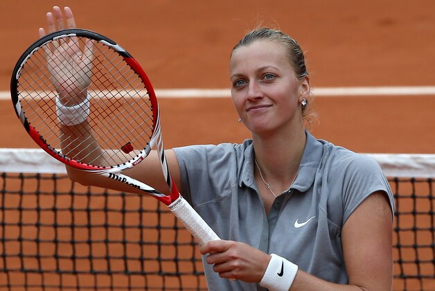 Petra Kvitova of the Czech Republic, waves after defeating New Zealand's Marina Erakovic in their second round match of  the French Open tennis tournament at the Roland Garros stadium, in Paris, France, Thursday, May 29, 2014. Kvitova won 6-4, 6-4. (AP Photo/Michel Euler)