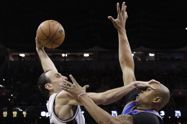 San Antonio Spurs' Manu Ginobili, left, shoots over Oklahoma City Thunder's Caron Butler (2) during the second half of Game 5 of the Western Conference finals NBA basketball playoff series, Thursday, May 29, 2014, in San Antonio. San Antonio won 117-89. (AP Photo/Eric Gay)