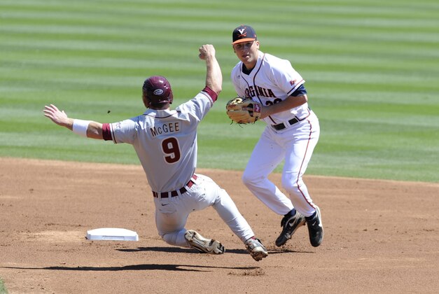 May 25, 2013; Durham, NC, USA; Florida State Seminoles player Stephen McGee (9) is forced out by Virginia Cavaliers infielder Nick Howard (33) on a double play during the ACC baseball tournament at Durham Bulls Athletic Park. Mandatory Credit: Liz Condo-USA TODAY Sports