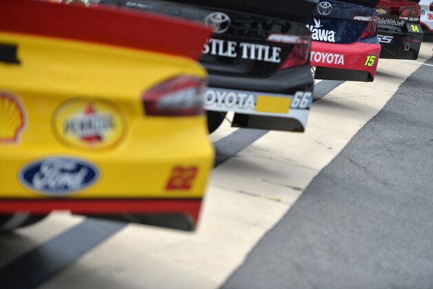 DOVER, DE - MAY 30:  A view of cars lined up on pit road during qualifying for the NASCAR Sprint Cup Series FedEx 400 Benefiting Autism Speaks at Dover International Speedway on May 30, 2014 in Dover, Delaware.  (Photo by Patrick Smith/Getty Images)